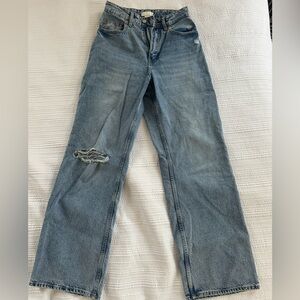 Blue Jeans ripped on the knee